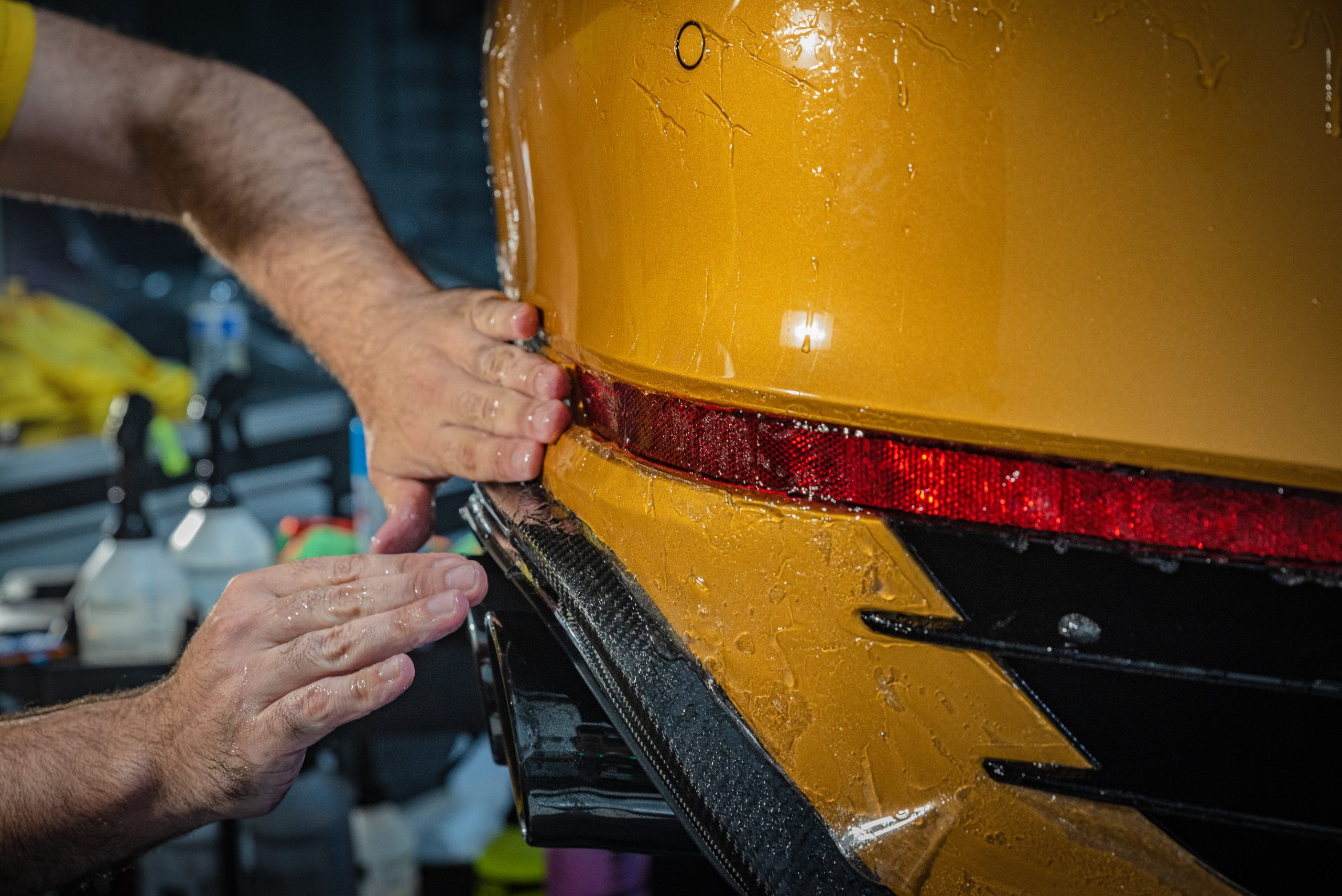 PPF owner Aleks applying product to a car